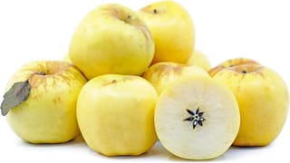 Apple 'Royal Gala/Golden Delicious' fruit, a pile of yellow apples with russet patches near the stalk, one halved to show pale flesh and seeds.