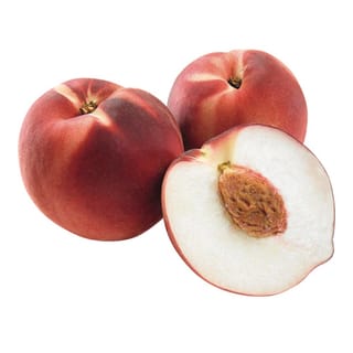 Peach 'April White' (Prunus persica) fruit: two whole red-blushed peaches beside a halved one showing white flesh and a brown stone, on white.