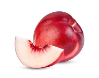 Nectarine 'Goldmine' (Prunus persica var. nectarina) fruit with smooth deep red skin beside a cut wedge showing white flesh and red staining near the stone, on white.