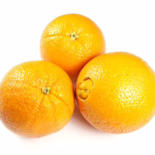 Three fresh Citrus orange 'Washington Navel' fruits. Bright orange peel, round shape, ready to eat.