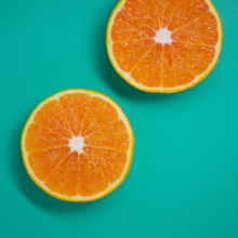 Citrus orange ‘Parent Navel’ (Orange) fruit halves.