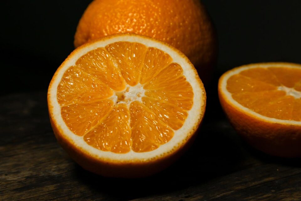 Citrus orange ‘Washington Navel’ (Orange) half fruit.